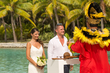 Traditional Polynesian wedding in Bora Bora. Gorgeous bride and handsome groom.