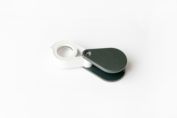 Magnifying glass for diamonds or see the amulet Isolated on a White Background.