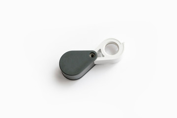 Magnifying glass for diamonds or see the amulet Isolated on a White Background.