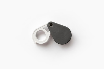 Magnifying glass for diamonds or see the amulet Isolated on a White Background.