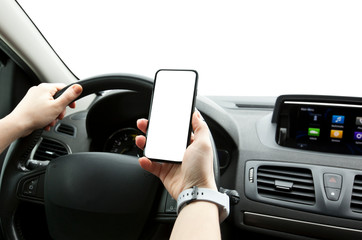 The young woman holding mobile phone with white screen sitting in her car