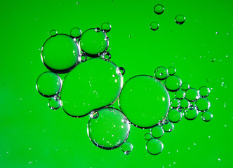Colorful oil drops on a water surface ideal for abstract background