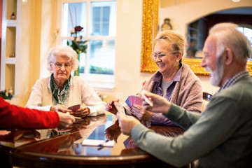 Senior people playing card games