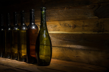 Old wine bottles in the dark.