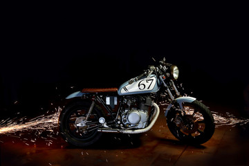 Plakat cafe racer motor cycle with grinding sparks