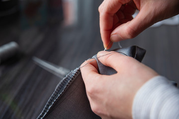 Close up of woman hand sewing