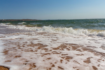Waves raining on the seashore in Crimea. Seascape