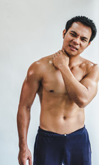 Obraz premium Asian man with muscular neck injury from exercise on White background.