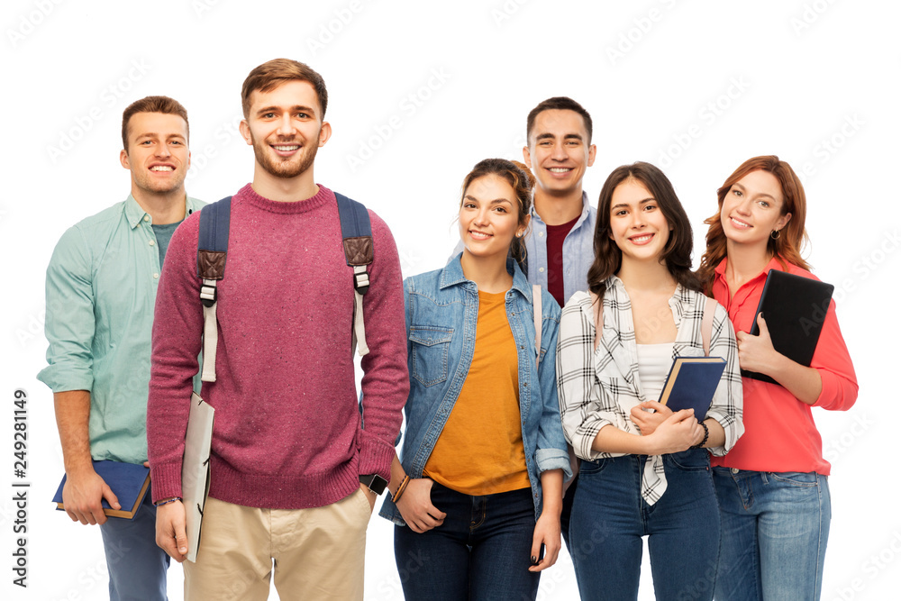 Wall mural education, high school and people concept - group of smiling students with books over white background