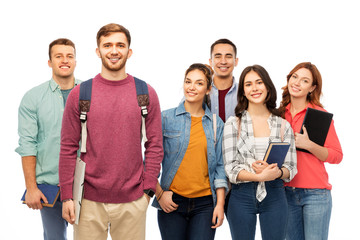 Obraz premium education, high school and people concept - group of smiling students with books over white background