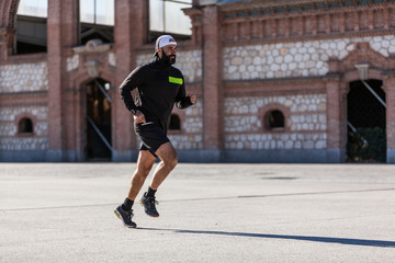 Two mature men running