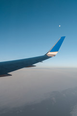 Obraz premium Full Moon during a flight over the Atlantic Ocean