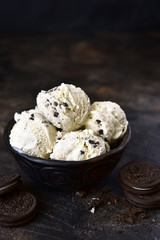 Homemade vanilla ice cream with chocolate and cookies.