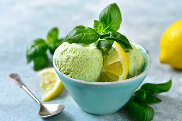 Basil lemon ice cream in a blue bowl.