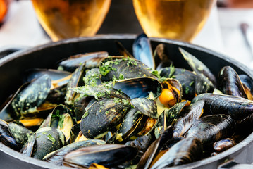 Steamed mussels with beer in restaurant a typical food from Brittany