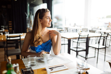 Beautiful woman enjoying her coffee