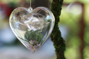 transparent heart with small pink flowers inside