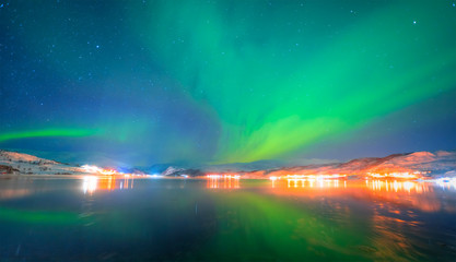 Fototapeta na wymiar Northern lights in the sky over Tromso, Norway