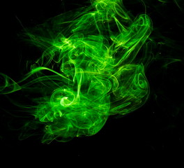 Green smoke on black background