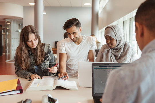 Students studying together in classroom