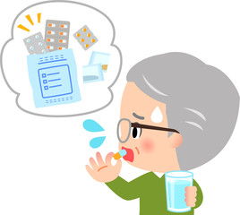 たくさんの薬を飲むシニア男性