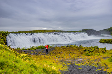 Beautiful, wide and wild Faxafoss waterfall in Eastern-South Iceland, near Reykjavik, summer time