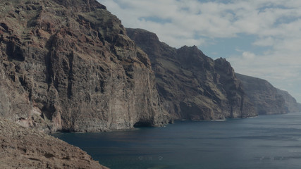 Fototapeta na wymiar Aerial survey above the Atlantic Ocean in Tenerife, Canary islands, the rocks Los Gigantos