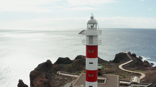 Aerial survey above the roads in Tenerife, Canary islands, lighthouse Teno