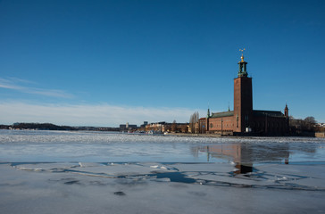 An early sunny spring day, meltwater under bridges at the Town City Hall government in Stockholm