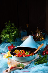 Tasty spicy beef with various vegetables cooked in tagine