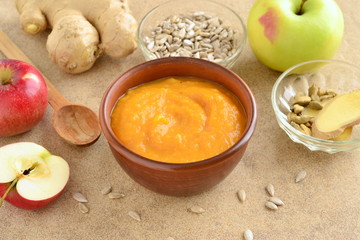 Roasted apple, pumpkin, ginger soup with cardamom, sprinkled with sunflower seeds