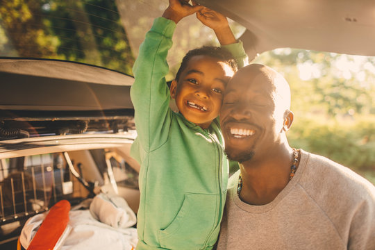 Smiling father and son enjoying in forest - Powered by Adobe