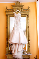 Beautiful wedding dress hanger in wardrobe
