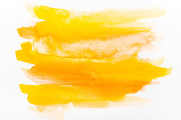 Fototapeta na wymiar top view of yellow watercolor brushstrokes on white paper