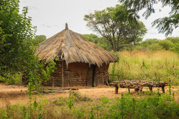 Traditional African authentic huts and straw fences on the border of Zambia and Namibia
