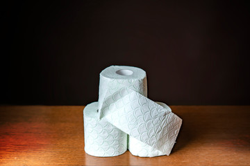 roll of toilet paper on a dark background