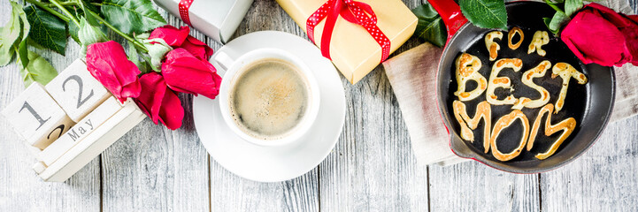 Mother's day greeting background concept, with red rose flowers, greeting card creative pancakes for best mom, i love mom, and coffee mug, wooden background copy space banner