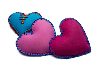 Hand stitched textile hearts isolated on white