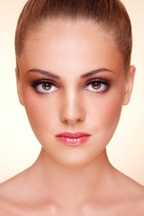 Fototapeta premium Close-up portrait of young beautiful tanned girl with stylish make-up
