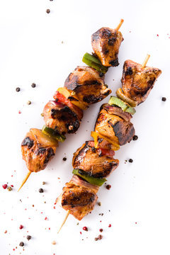 Chicken shish kebab with vegetables isolated on white background. Top view