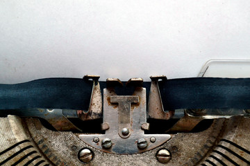 A blank sheet of paper is inserted into an old typewriter. A place to record thoughts.