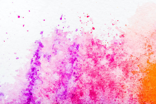 top view of pink watercolor spill on white paper © LIGHTFIELD STUDIOS