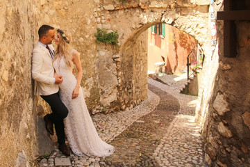 Beautiful wedding couple posing in ancient city