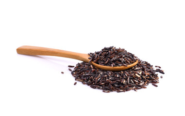 brown rice on wooden spoon on white background.