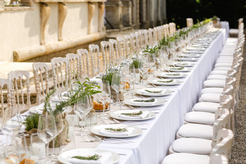 Elegant table setting for wedding at castle