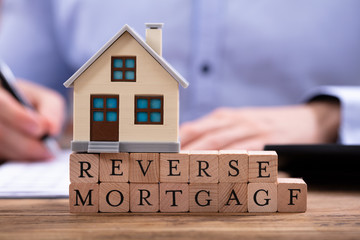 Reverse Mortgage In Front Of Businessman