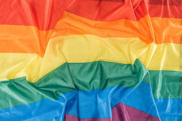 top view of creased lgbt rainbow flag, lgbt concept