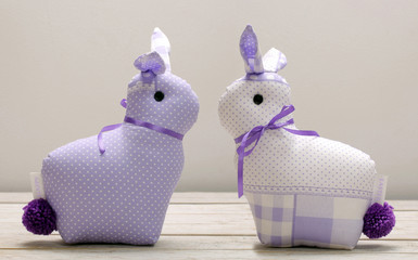 Two Easter bunnies and empty space for text. Easter holiday concept.
