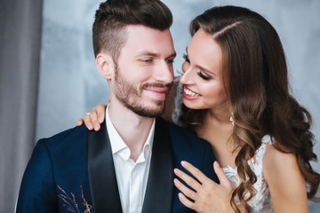 Wedding couple hugging each other indoor.Close-up portrait of wedding couple . Beauty bride with groom.
