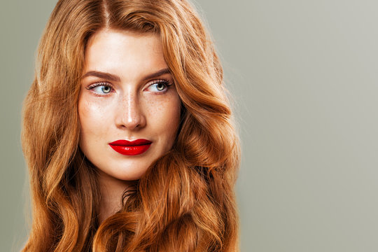 Red Head Woman With Freckles And Ginger Hair. Natural Redhead Girl, Beautiful Female Model Face Closeup